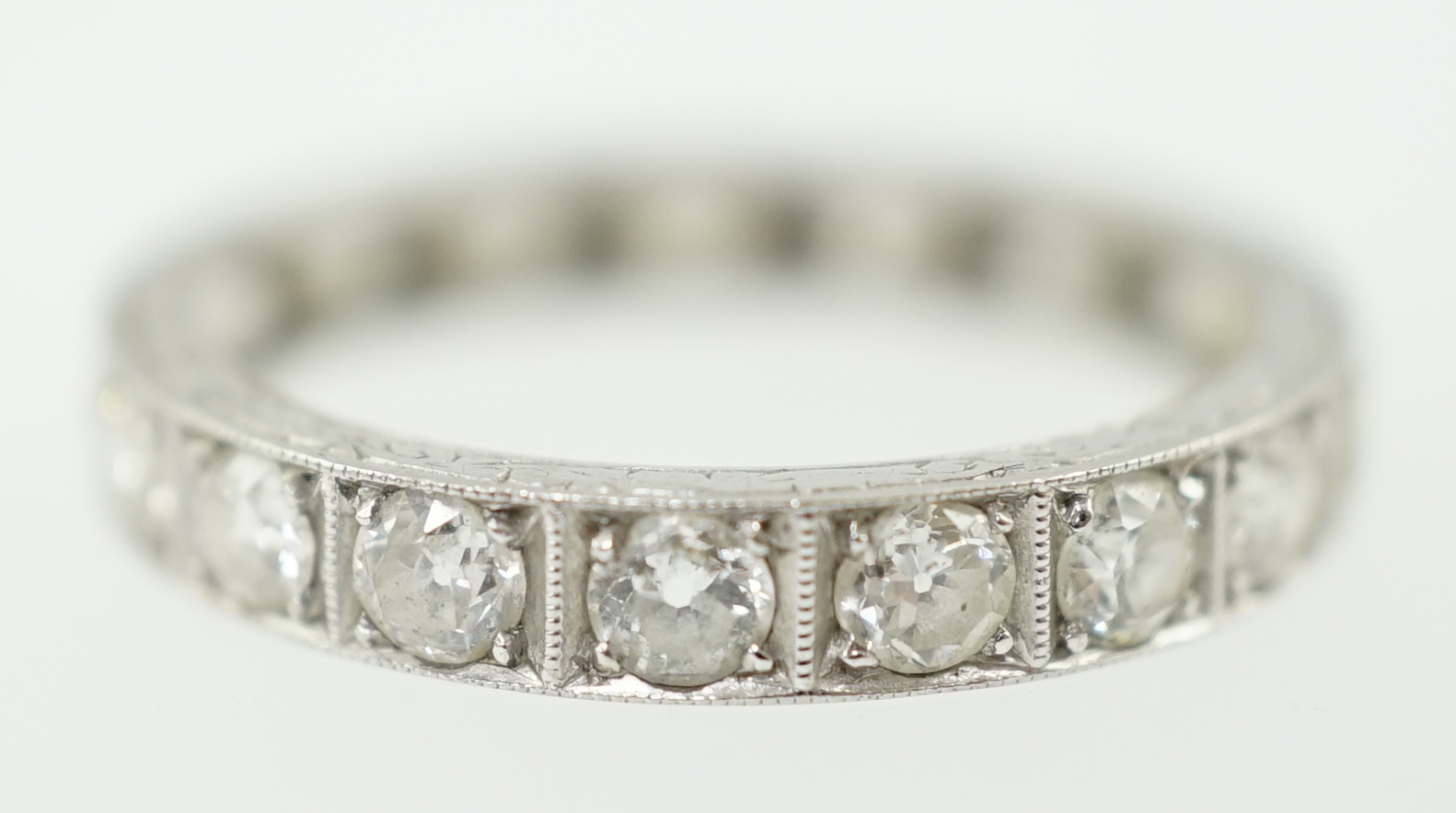 A mid 20th century platinum and diamond set full eternity ring